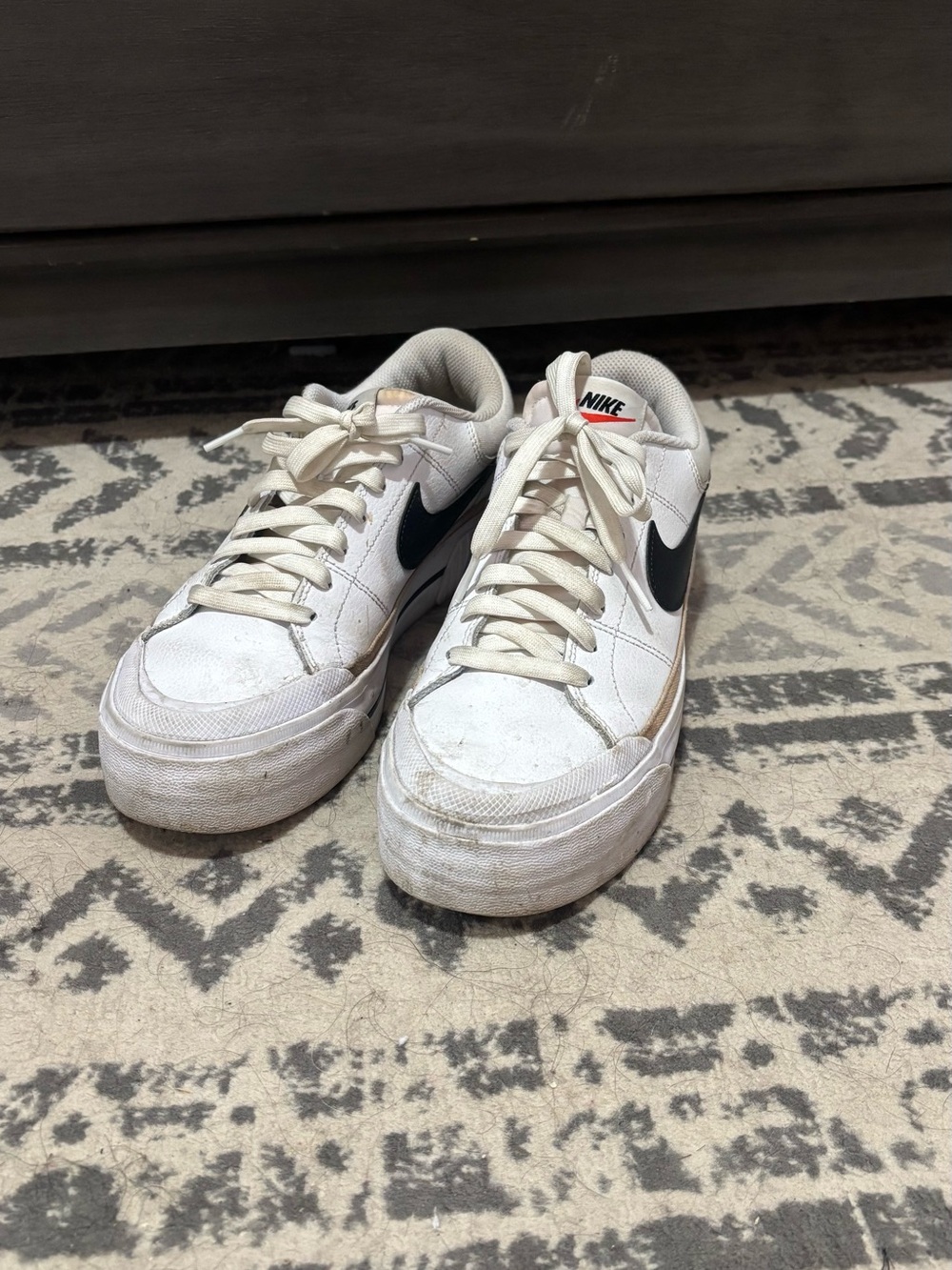 Nike White Low-Top Sneakers with Black Swoosh Accent